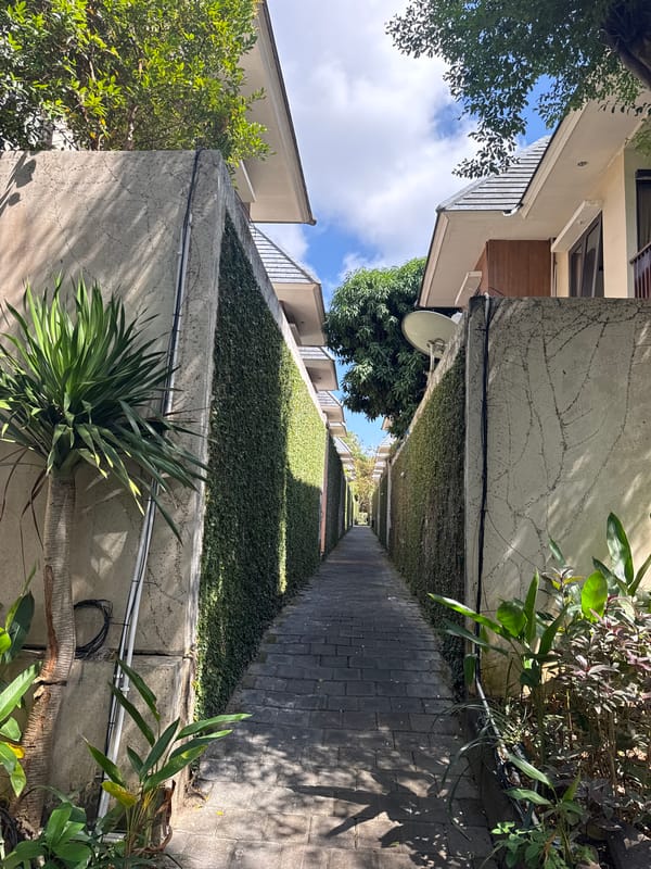 Morning grounds tour of a lush villa complex in Kuta Selatan