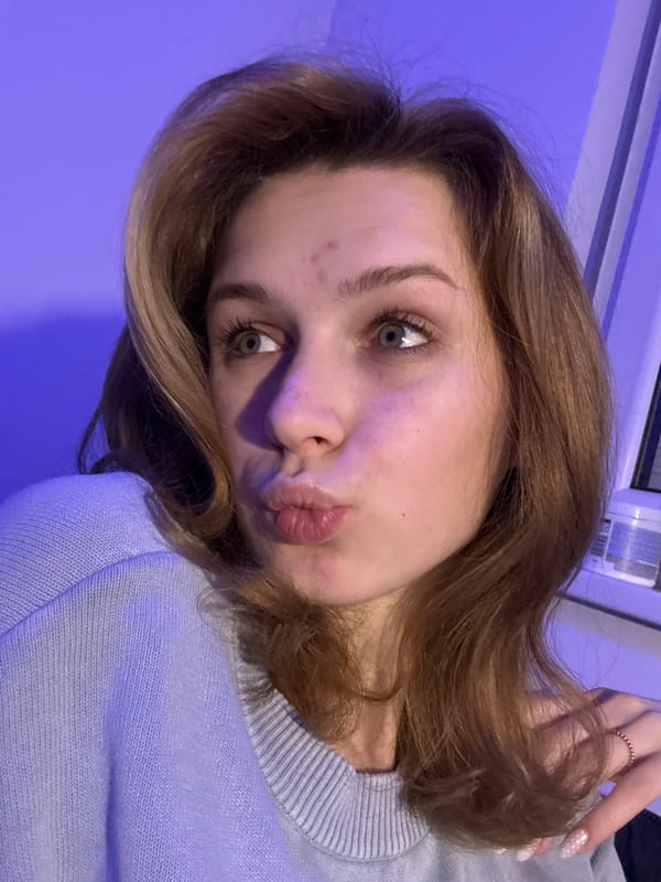 Woman poses for camera with pouting expression in Kragujevac