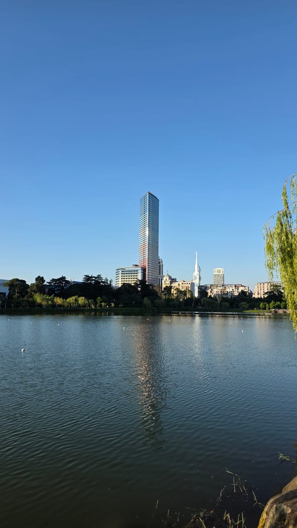 Batumi waterfront: modern towers, parked bikes, and street scenes