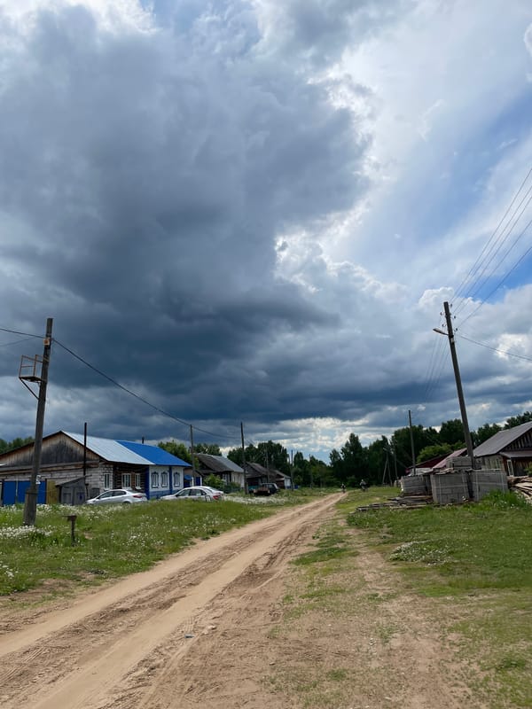 Storm clouds gather over rural Russian village Балдейка