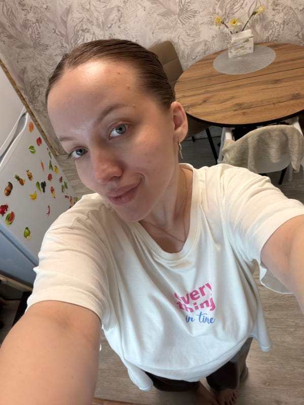 Woman takes selfie at home in Reshetnikovo kitchen