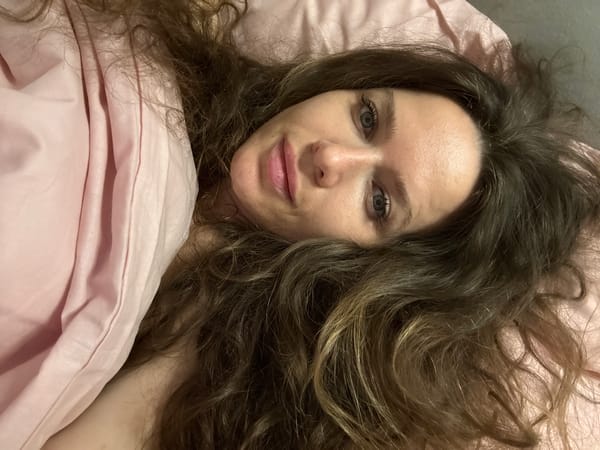 Woman photographed in bed in Moscow evening hours