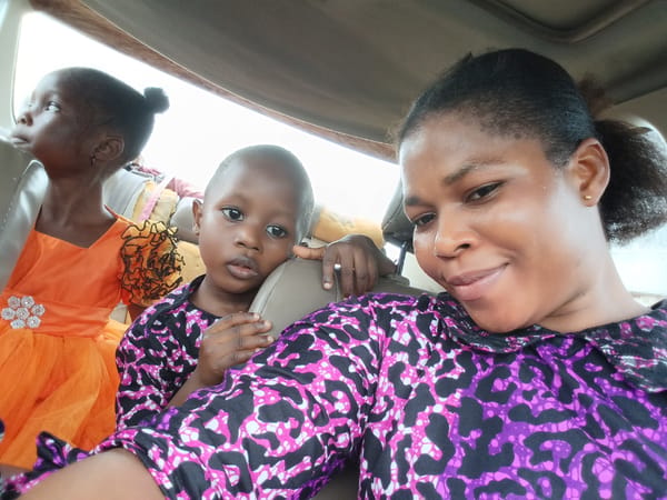 Rainy day ride through Yenagoa with a cheerful group