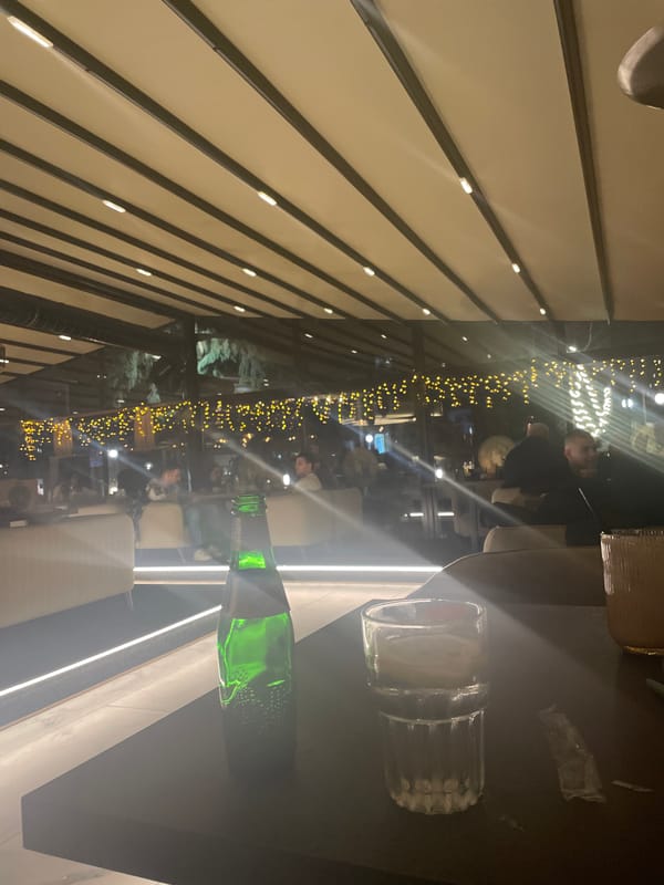 Evening crowd gathers at lit cafe in Stara Zagora