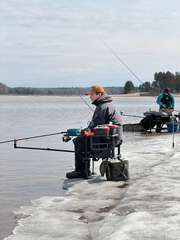 Ice fishing observed near Chaykovsky, Russia in daylight