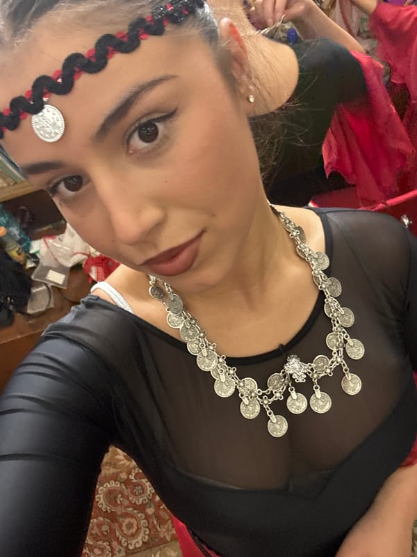 Woman in traditional coin jewelry observed at location