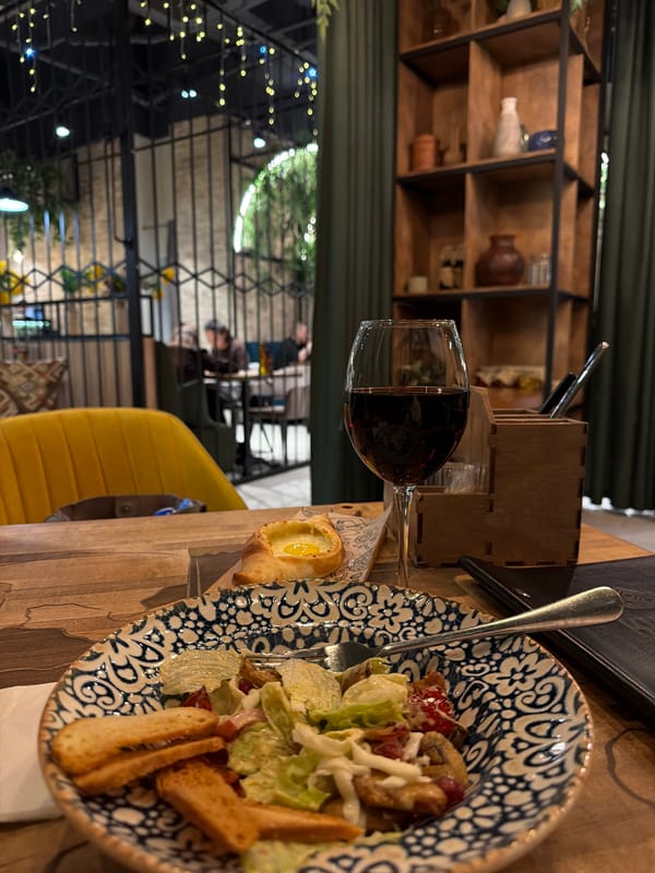 Restaurant table setting documented with salad meal