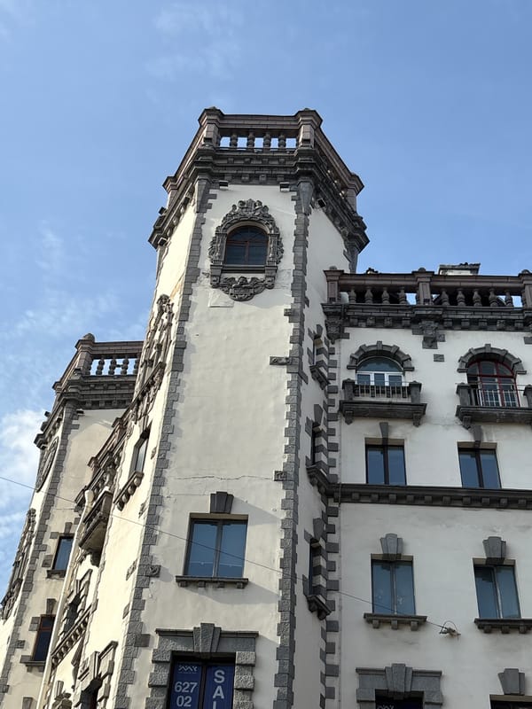 Ornate Saint Petersburg building facade, bay window and stone details
