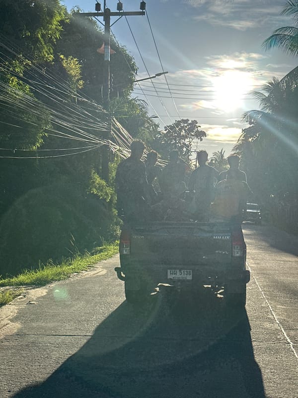 Pickup truck carries passengers through Koh Phangan streets