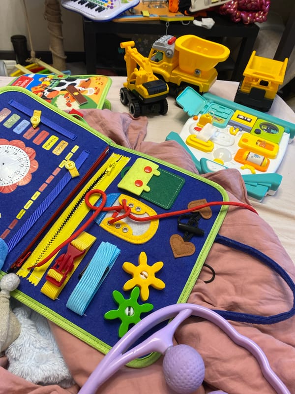 Close-up look at a kids' busy board and RC rally car