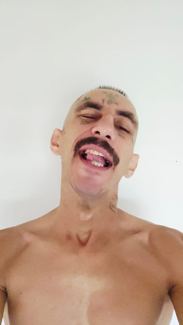 Tattooed man photographed in portrait session in Cam Lâm