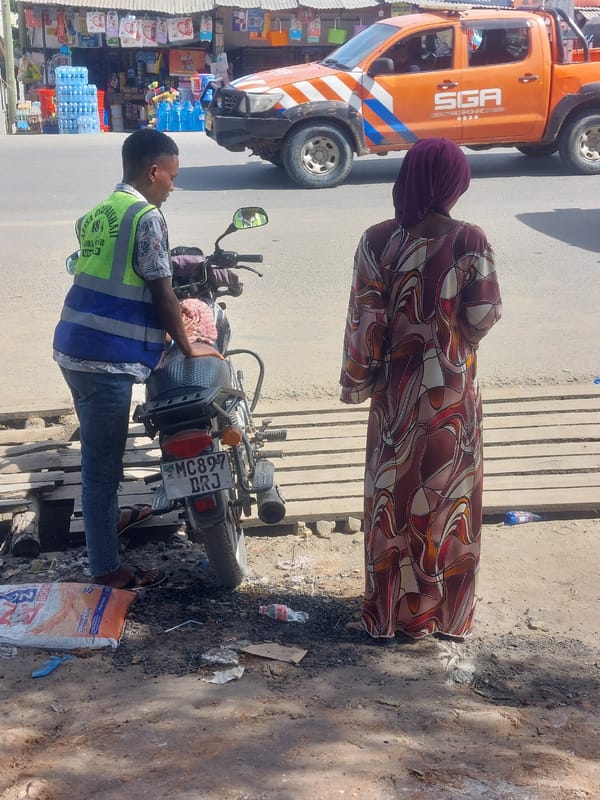 Street food vendors serve customers across Dar es-Salaam