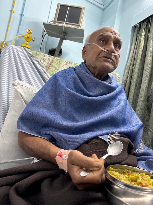 Elderly man receiving medical care in Kolkata facility