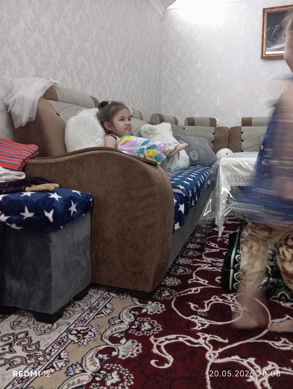 Children play and dance at home in Bekabad, Uzbekistan