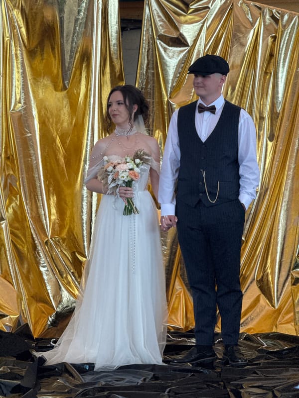Wedding ceremony held at waterfront venue with covered patio