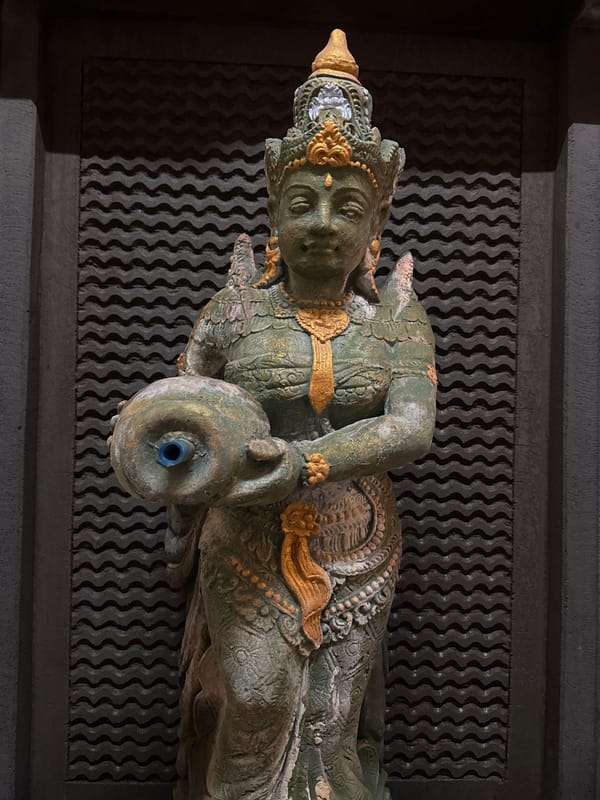 Night ride through Kuta, Bali, with art, traffic, and a gym stop