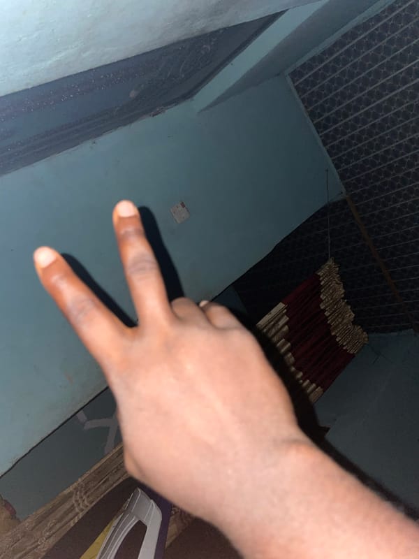 Person documents home environment with hand gestures in Jalingo