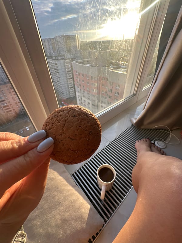 Person enjoys snack by sunny window in Gavrilkovo
