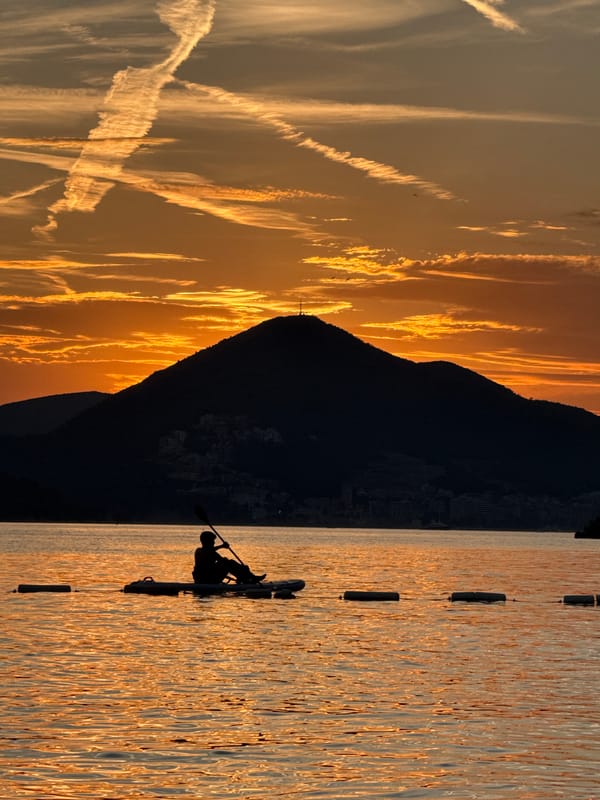 Sunset paddling on calm Adriatic waters in Pržno