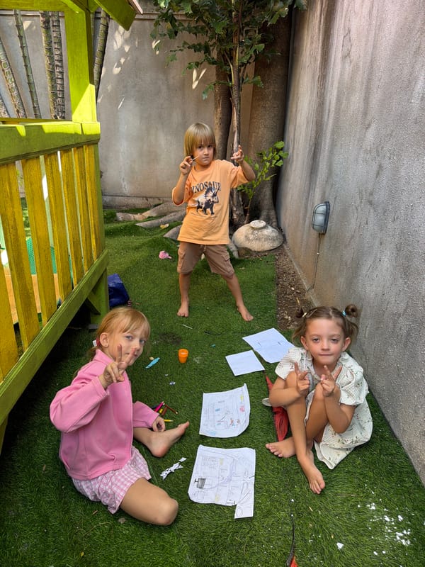 Kids playing in a Kuta backyard on a June morning