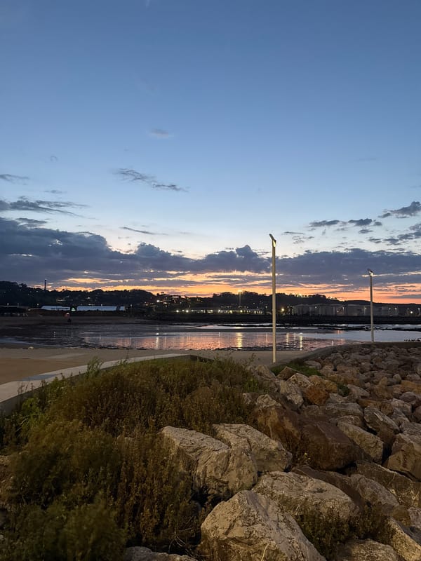 Sunset to nighttime coastal views in Gijón, Spain