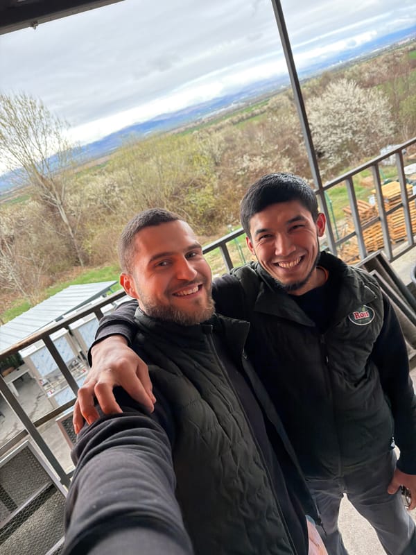 Two men take selfie on balcony in Lozen, Bulgaria
