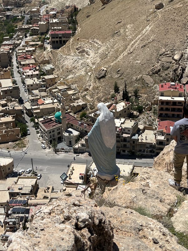 Tourists explore scenic overlooks above historic Ma'loula, Syria