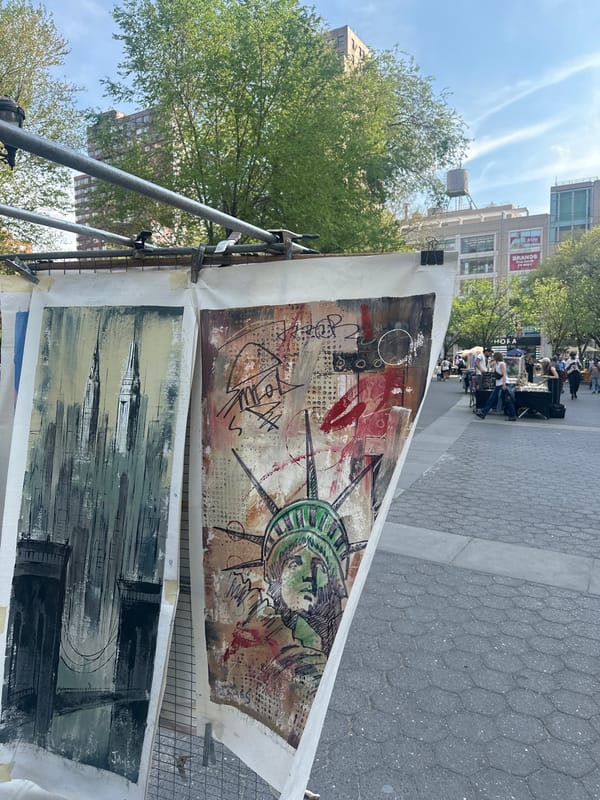Street artist displays abstract paintings in NYC public square
