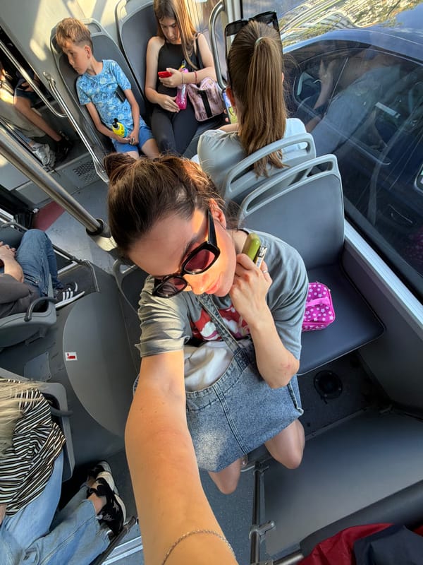 Passengers travel on Belgrade bus, woman takes selfie