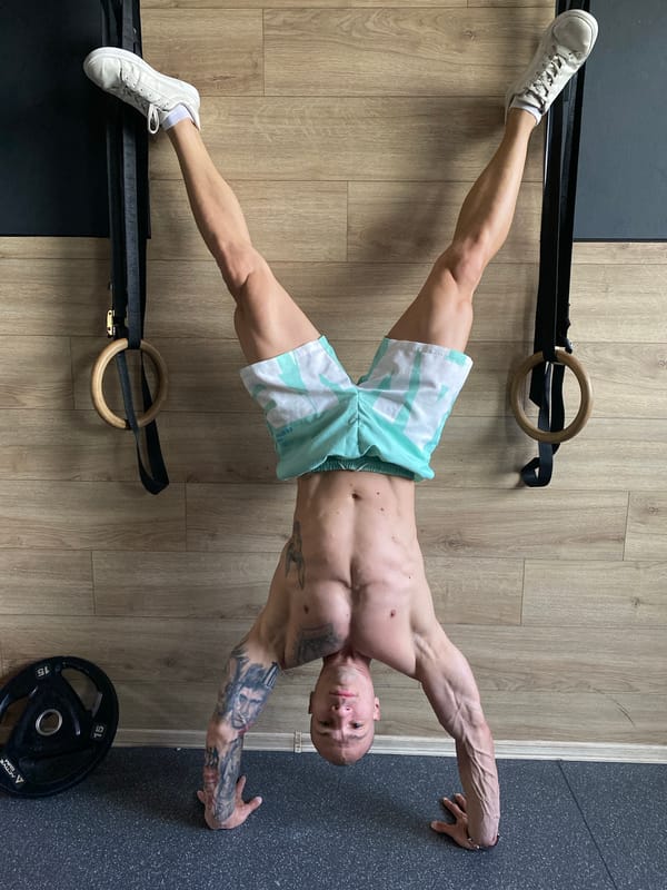 Tattooed athlete performs calisthenics workout in Pleven home gym