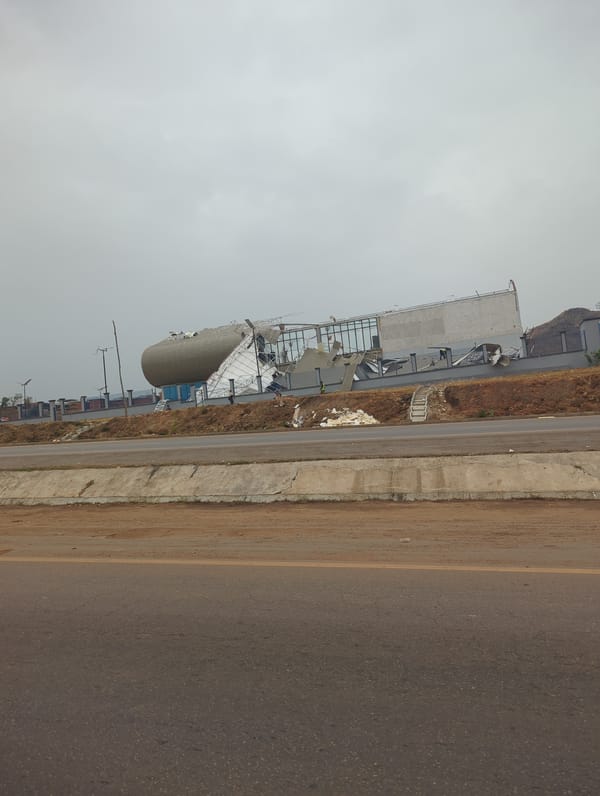 Building with storage tank and debris documented in Kugbo