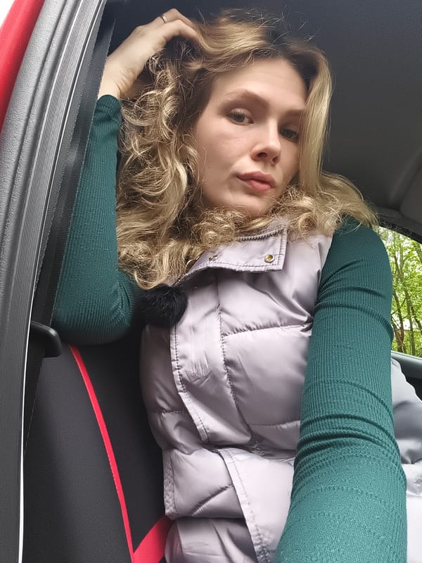 Woman in puffer vest observed in car, Izhevsk