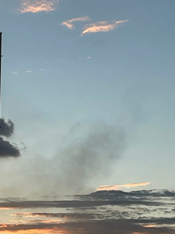 Omsk skies tracked through clouds, color shifts, and a smoke plume