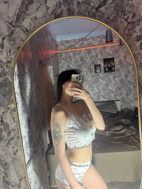 Woman takes mirror selfies in Moldovan village