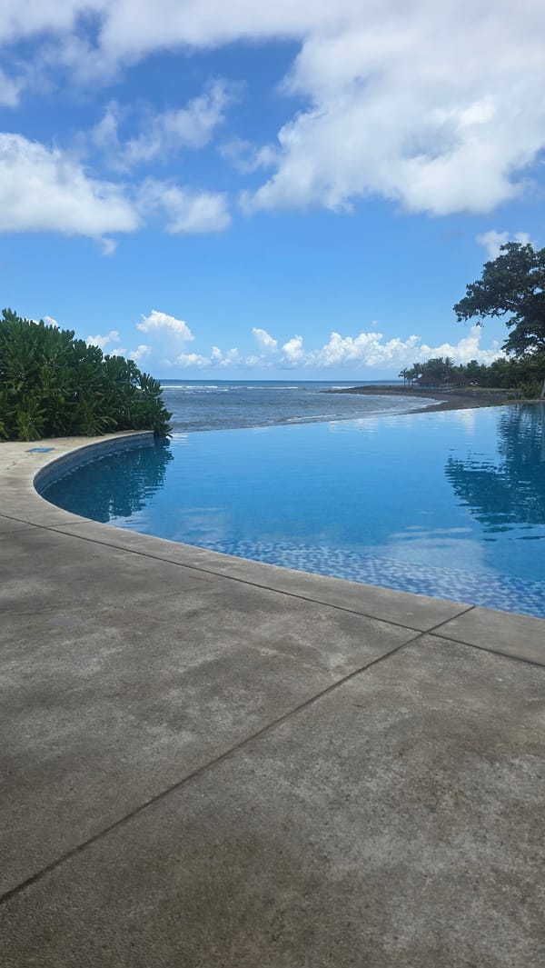 Early morning relaxation at Indonesian beachfront infinity pool resort