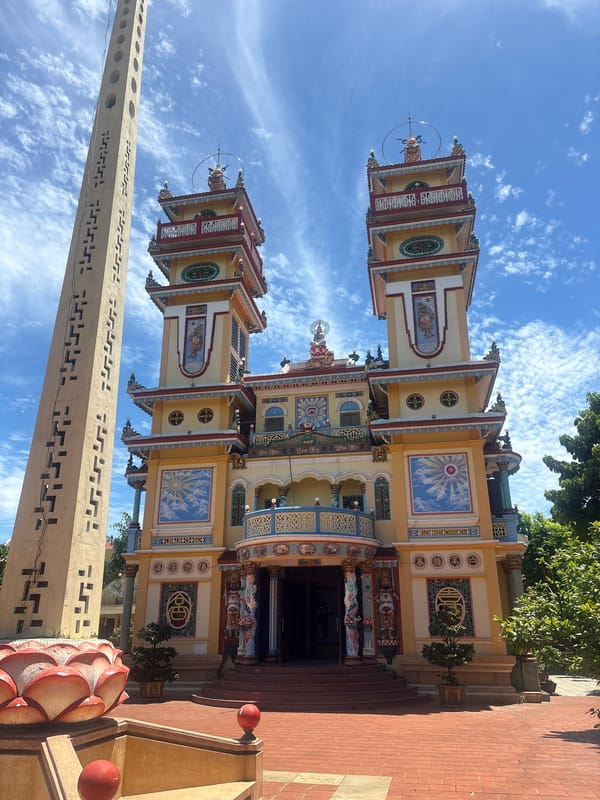 Tu Van Pagoda's colorful towers under clear Hoi An skies