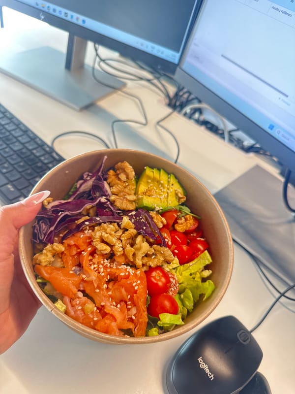 Person prepares salmon salad with dressing in Alicante