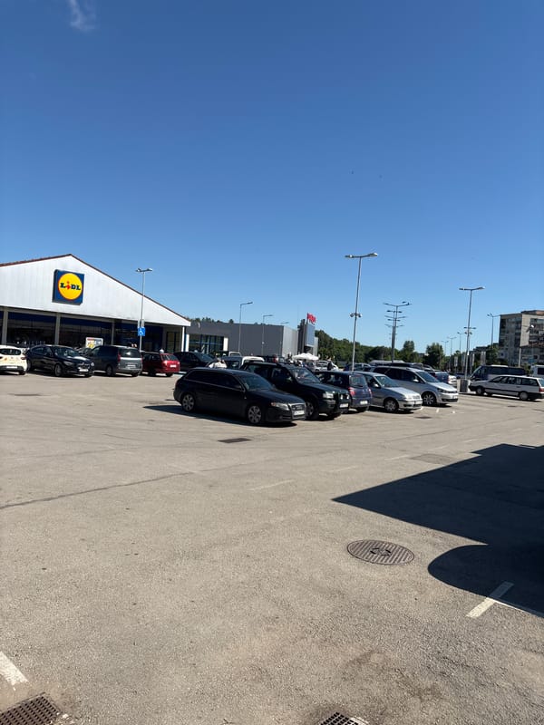 Busy Lidl store parking lot observed in Lovech, Bulgaria