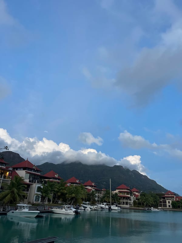 Dusk over Providence harbor, Seychelles, with boats and red rooftops