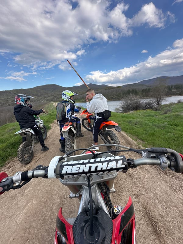Dirt bikers gather near water in Iskra, Bulgaria
