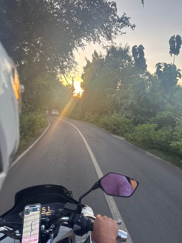 Motorcycle rider captures sunrise journey through scenic roads
