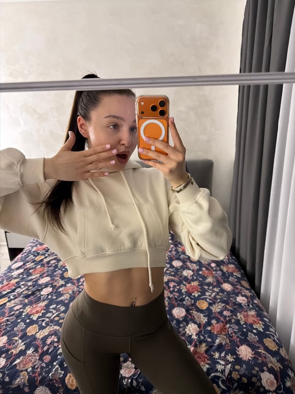 Woman documents evening routine with mirror selfies in Pernik bedroom