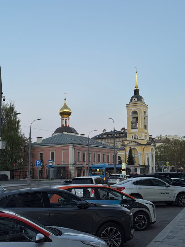 Moscow street scenes documented showing churches, buildings under clear skies