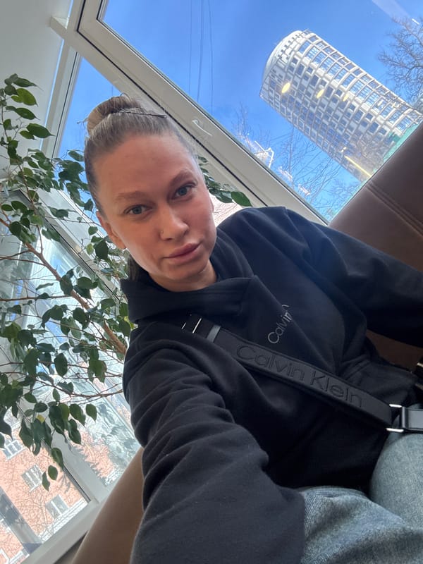 Person photographs self in decorated interior space in Perm