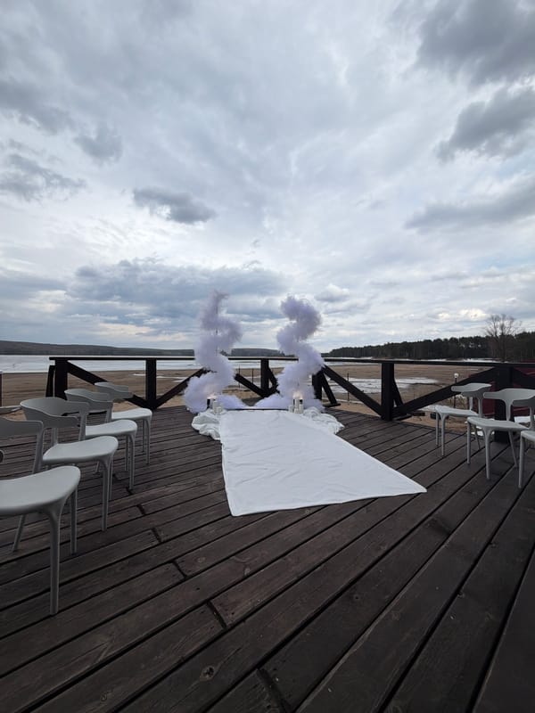 Outdoor wedding ceremony preparations captured in Chaikovsky, Russia