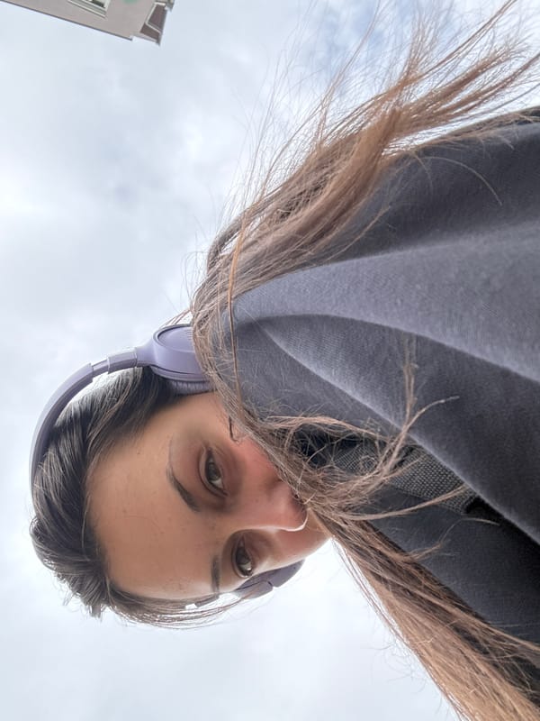 Woman in purple headphones photographed in Kragujevac, Serbia