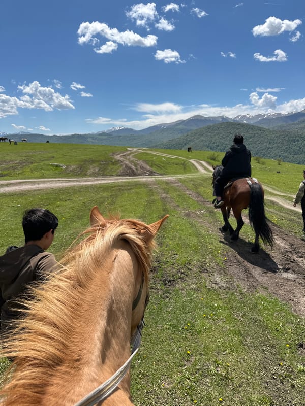 Horseback riders enjoy mountain meadows near Teghut, Armenia