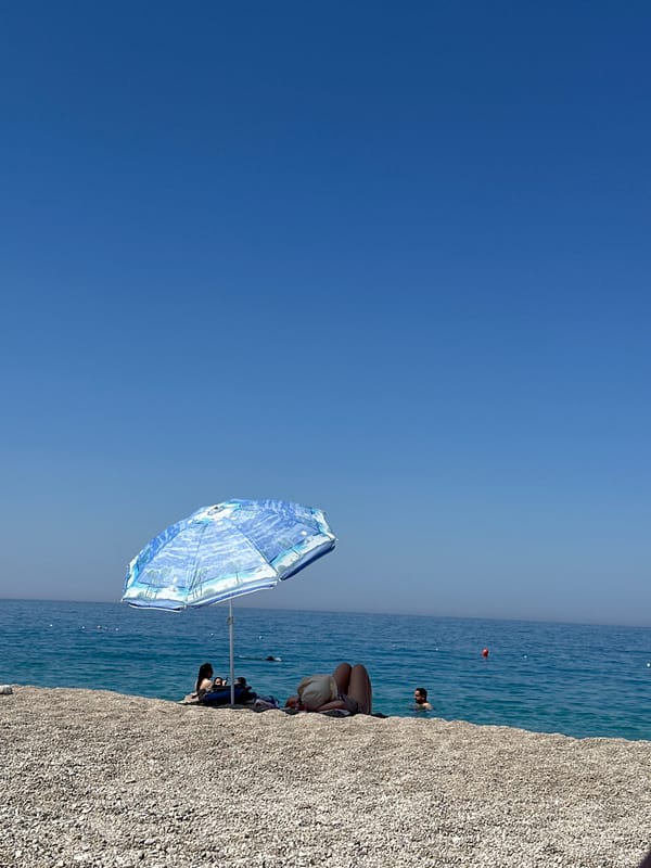 Sunny morning on a pebble beach in Fethiye, Turkey