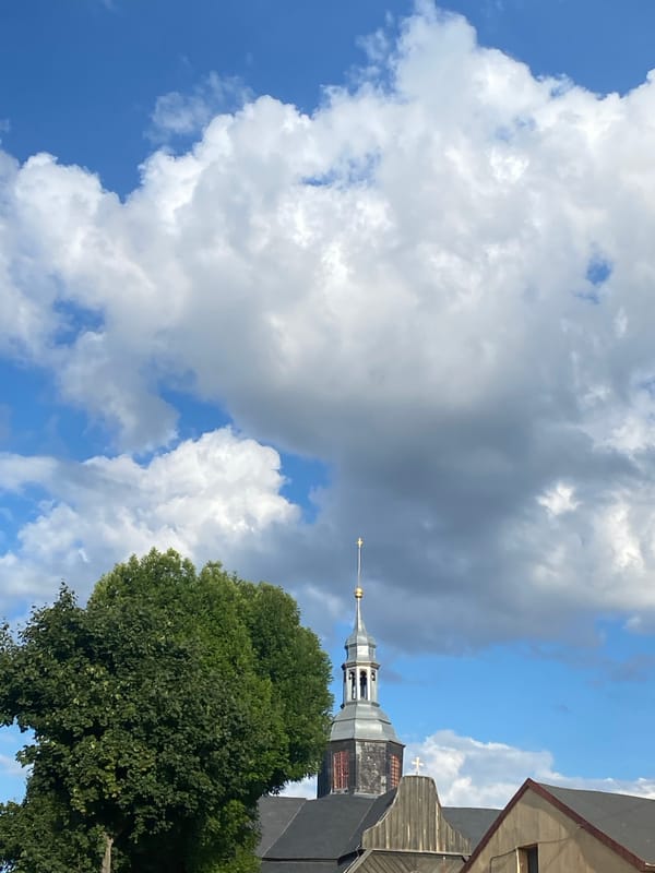 Hotel room and church steeple in Buk, Poland