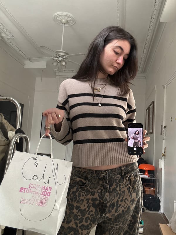 Woman takes shopping selfies in New York indoor location